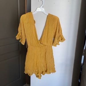 Yellow romper. Worn to try on